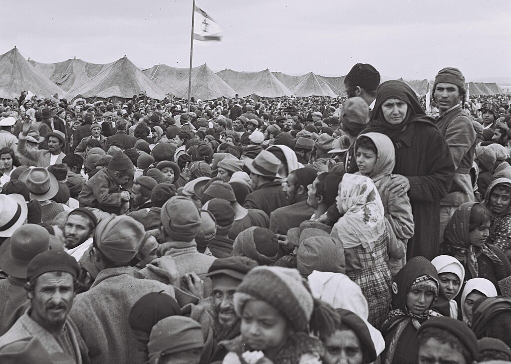Immigrants from Yemen celebrating their first "Tu Bishvat" in Israel, at the "Rosh Ha'Ayin" immigrants camp, 1950 IWikimedia Commons)