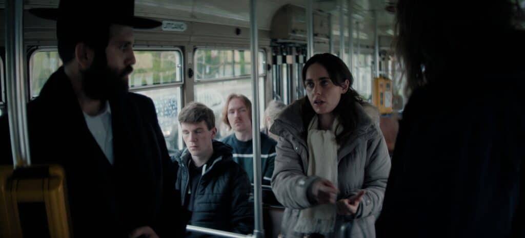 Libbi (Hadas Yaron) tries to help a man wo doesn't have his ticket on a bus.  (Courtesy of Izzy)