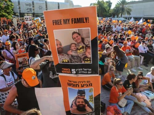 Participants lift placards and pictures during a gathering in Tel Aviv on August 5, 2024 to mark the fifth birthday of Ariel Bibas, held hostage in Gaza, and to call for the liberation of him and his family. Ariel, his baby brother Kfir, who would now be one year old, were kidnapped along with their parents Yarden and Shiri from their homes in Nir Oz kibbutz community near Gaza on October 7 when Hamas terrorists attacked southern Israel.