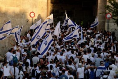 Israeli right-wing activists gather with Israeli national flags at the Damascus Gate of the old city of Jerusalem on June 5, 2024, during the Jerusalem Day flag march which commemorates the Israeli army's capture in the 1967 Arab-Israeli war of the city's eastern sector home to the Temple Mount. (Photo by Menahem KAHANA / AFP) (Photo by MENAHEM KAHANA/AFP via Getty Images)