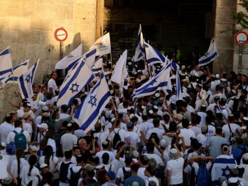 Israeli right-wing activists gather with Israeli national flags at the Damascus Gate of the old city of Jerusalem on June 5, 2024, during the Jerusalem Day flag march which commemorates the Israeli army's capture in the 1967 Arab-Israeli war of the city's eastern sector home to the Temple Mount. (Photo by Menahem KAHANA / AFP) (Photo by MENAHEM KAHANA/AFP via Getty Images)
