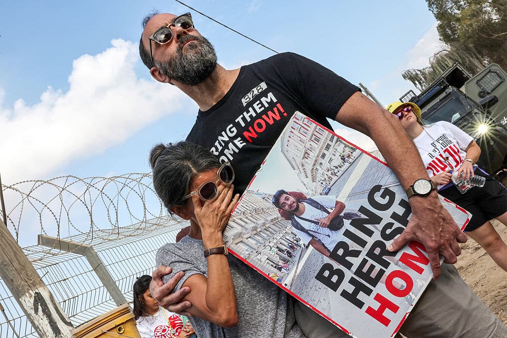 Jonathan Polin and Rachel Goldberg, parents of Israeli hostage Hersh Goldberg-Polin, attend a demonstration by the families of the hostages taken captive in the Gaza Strip since the October 7 attacks by Palestinian militants calling for the hostages' release, near Kibbutz Nirim in southern Israel by the border with Gaza on August 29, 2024 amid the ongoing conflict in the Palestinian territory between Israel and Hamas. (Photo by JACK GUEZ / AFP) (Photo by JACK GUEZ/AFP via Getty Images)