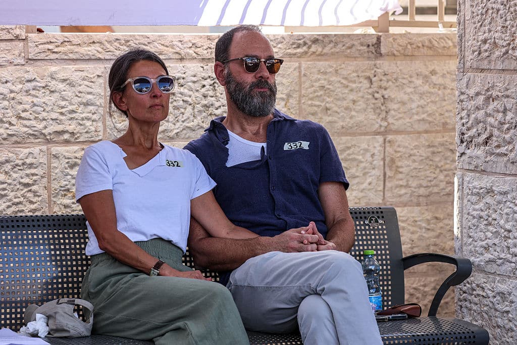 Jonathan Polin and Rachel Goldberg, parents of killed US-Israeli hostage Hersh Goldberg-Polin whose body was recovered with five other hostages in Gaza, react during the funeral in Jerusalem on September 2, 2024, amid the ongoing conflict between Israel and the Palestinian militant group Hamas. The six were among 251 hostages seized during Hamas's October 7 attack that triggered the ongoing war between Israel and Hamas. (Photo by GIL COHEN-MAGEN / POOL / AFP) (Photo by GIL COHEN-MAGEN/POOL/AFP via Getty Images)