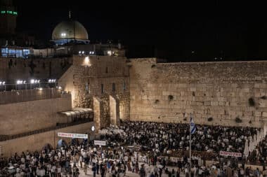 Ultra-Orthodox Jewish men gather for prayers and a reading from the biblical Book of Lamentations at the Western Wall in Jerusalem's Old City on August 2, 2025, during the annual Tisha B'Av (Ninth of Av) fasting and memorial day, commemorating the destruction of ancient Jewish temples some 2000 years ago. (Photo by Menahem Kahana / AFP) (Photo by MENAHEM KAHANA/AFP via Getty Images)