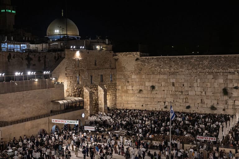 Ultra-Orthodox Jewish men gather for prayers and a reading from the biblical Book of Lamentations at the Western Wall in Jerusalem's Old City on August 2, 2025, during the annual Tisha B'Av (Ninth of Av) fasting and memorial day, commemorating the destruction of ancient Jewish temples some 2000 years ago. (Photo by Menahem Kahana / AFP) (Photo by MENAHEM KAHANA/AFP via Getty Images)