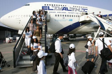 BEN GURION AIRPORT, ISRAEL: New Jewish immigrants making Aliyah (Immigration to Israel) from France walk down the airplane upon their arrival at the Ben Gurion International airport in Lod, about 15 kms east of Tel Aviv, 25 July 2007. At least 600 new French Jewish immigrants were expected to arrive to Israel assisted by the Jewish Agency for Israel, a record number of olim (immigrants) from France this year since 1972. AFP PHOTO/JACK GUEZ (Photo credit should read JACK GUEZ/AFP via Getty Images)