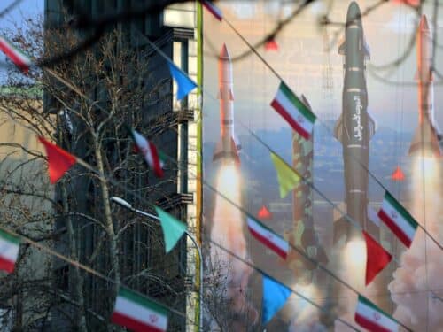 A view of a banner hung on a building reading in Persian and Hebrew 'We are stronger and more motivated than ever. Are you ready for 2 million displaced people?' with pictures of Iranian missiles as tensions between Iran and Israel continue to escalate in Palestine Square of the capital Tehran, Iran.
