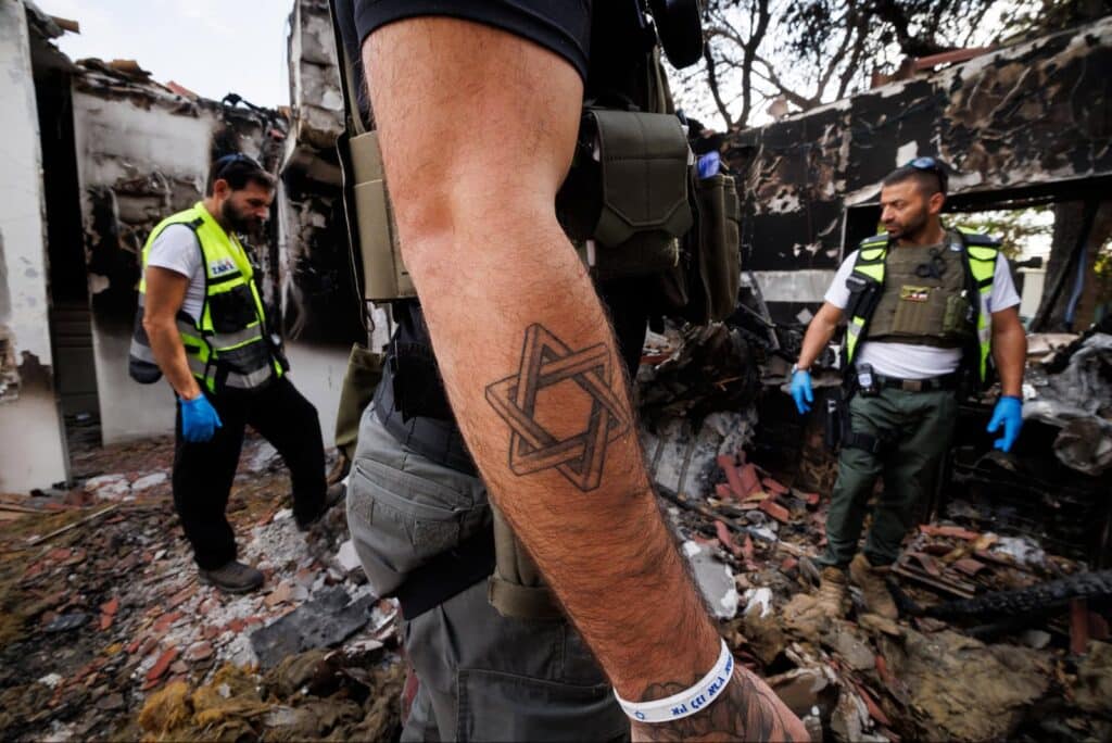 ZAKA volunteers collecting hair, blood and pieces of flesh for proper burial, from a house attacked by Hamas terrorists on October 7, 2023. Photo by Ziv Koren/Polaris Images