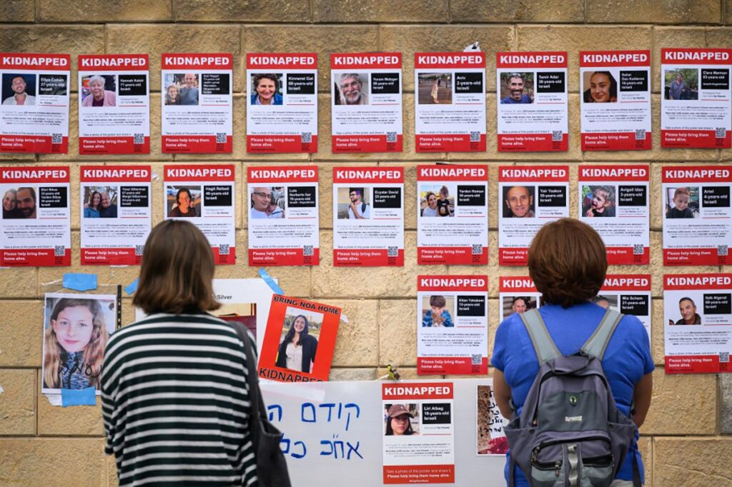 Photographs of some of those taken hostage by Hamas terrorists during their recent attacks are seen on October 18, 2023 in Tel Aviv, Israel. (Photo by Leon Neal/Getty Images)