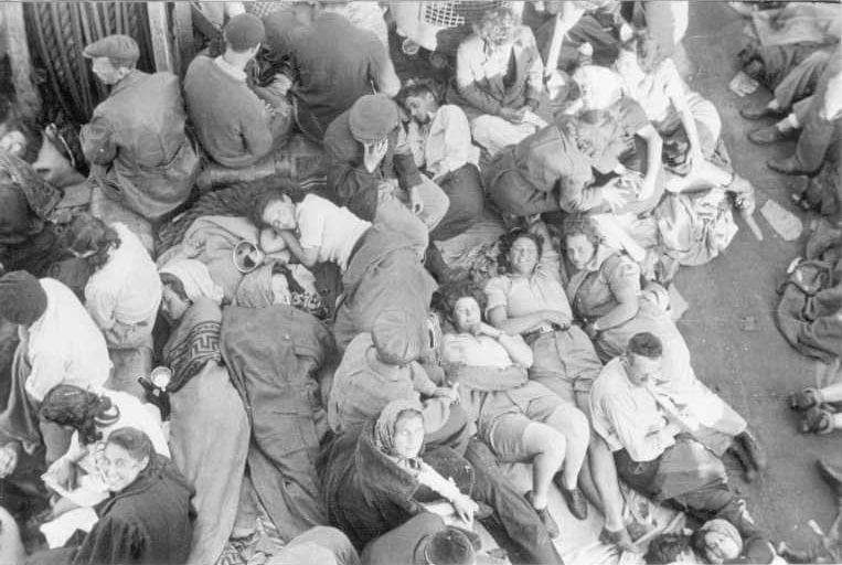 Refugees asleep on the deck of the Biria (Wikimedia Commons)
