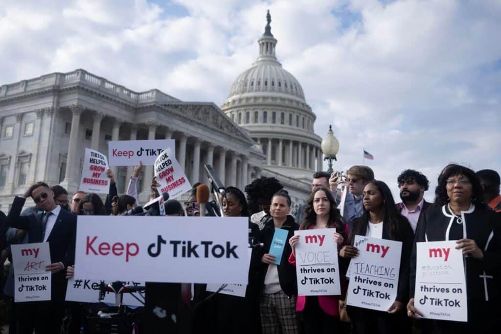 People gather for a press conference about their opposition to a TikTok ban on Capitol Hill in Washington, DC on March 22, 2023. (Photo by Brendan Smialowski / AFP via Getty Images)