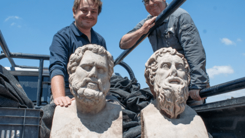 Archaeologists Eliran Oren and Michael Sorotskin with the Roman statues discovered in northern Israel.