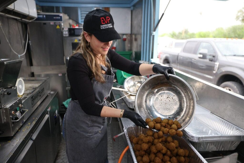 A participant in the Emergency Volunteers Project’s Mass Feeding Unit. Photo courtesy of EVP