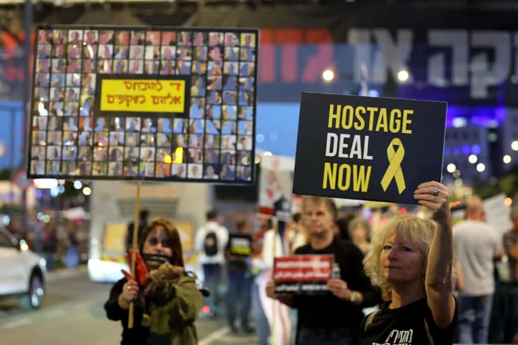 Relatives and supporters of hostages taken captive by Hamas on Oct. 7 hold placards during a demonstration calling for their release, in Tel Aviv on May 9, 2024. (Photo by Jack Guez/AFP via Getty Images)