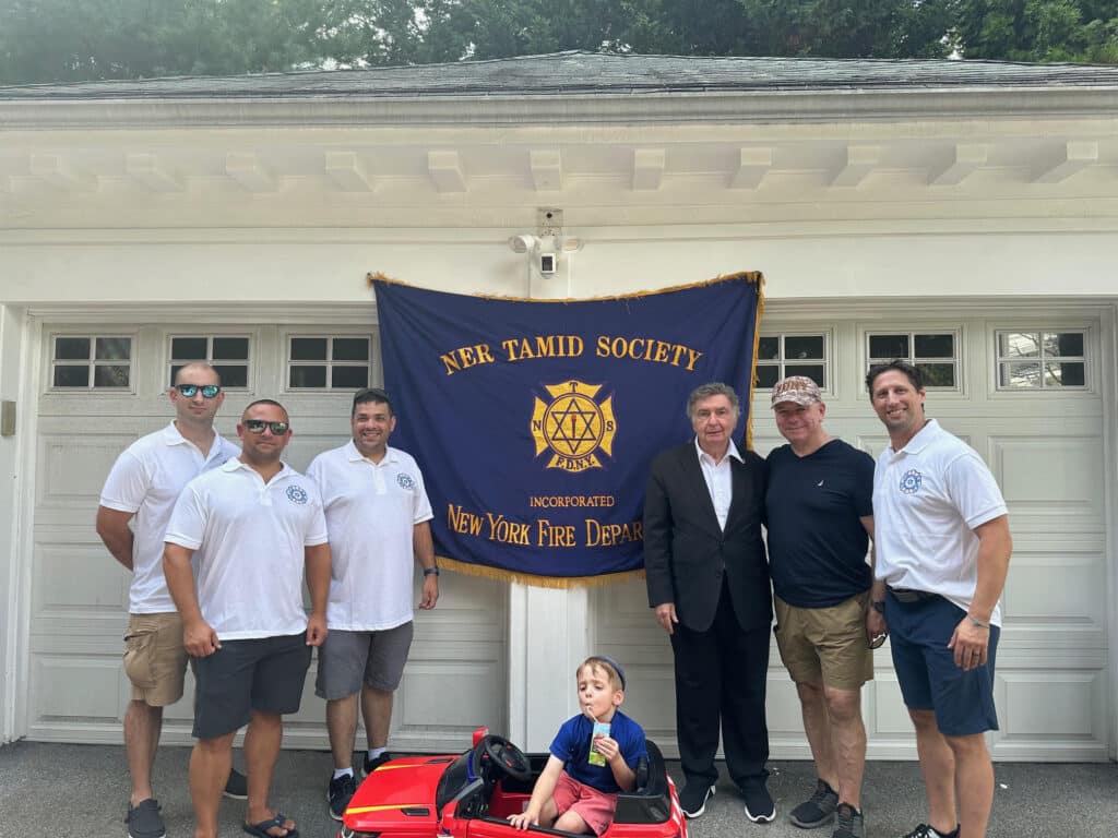 Ner Tamid firefighters in Borough Park, where they hosted a fire safety lecture at Hanukkah. 